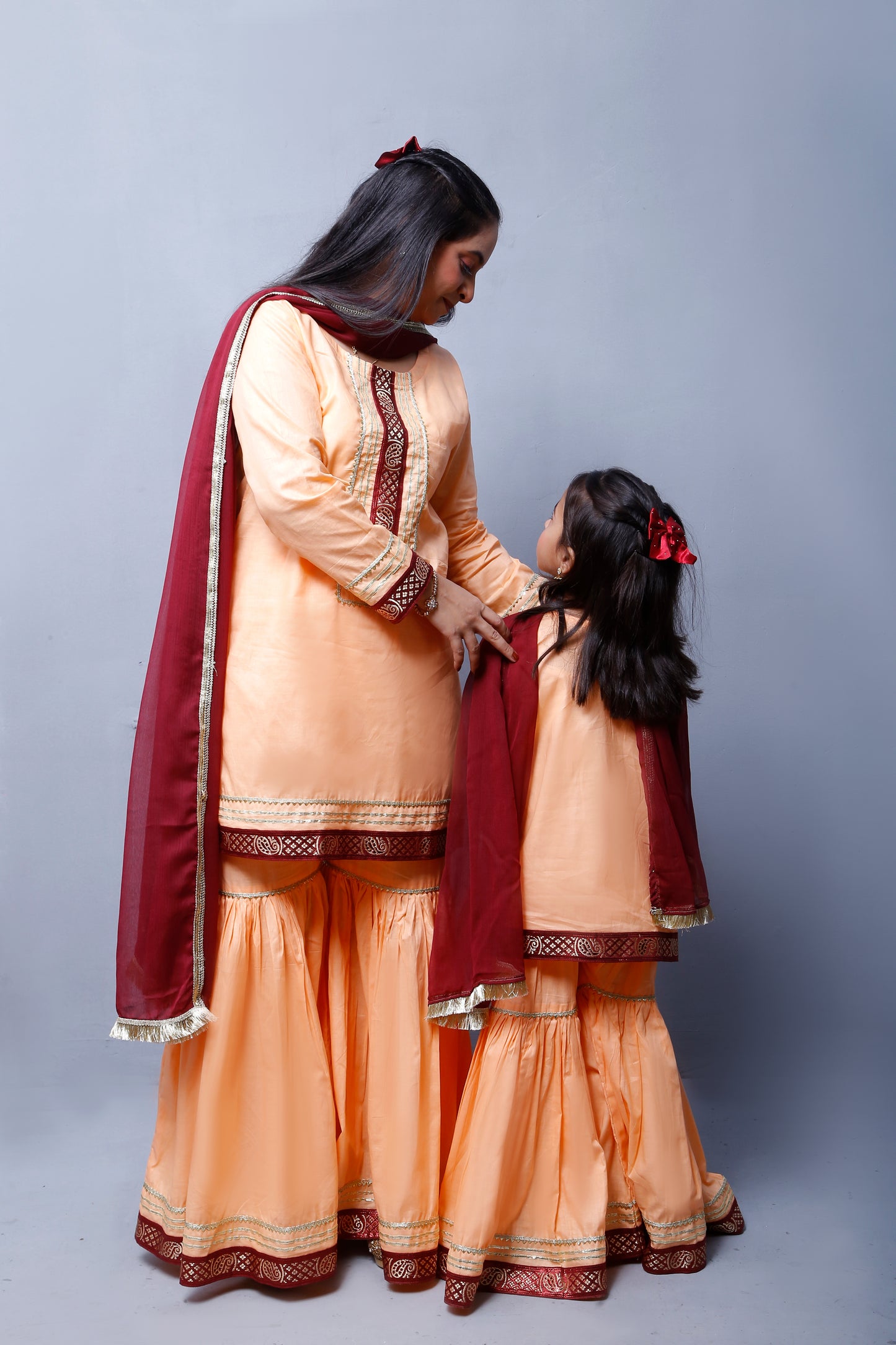 3 piece Elegant Peach Cotton Sleeveless Gharara Suit with Maroon & Golden Laces with Maroon Chiffon Dupatta.(Stitch)