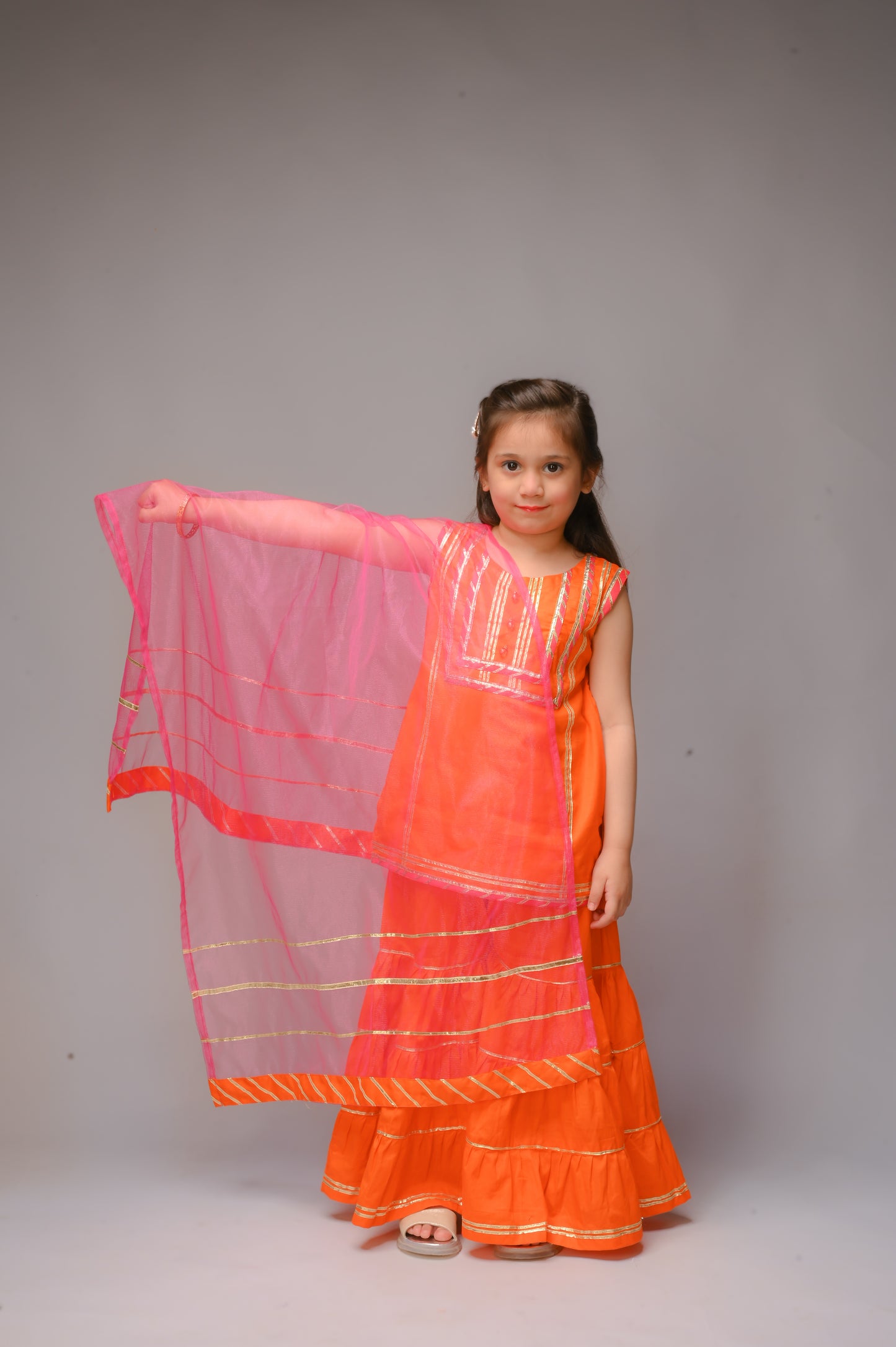 3 piece Orange Cotton Sleeveless Gharara Suit with Shocking Pink net Dupatta & Shocking Pink & Golden Laces.(Stitch).