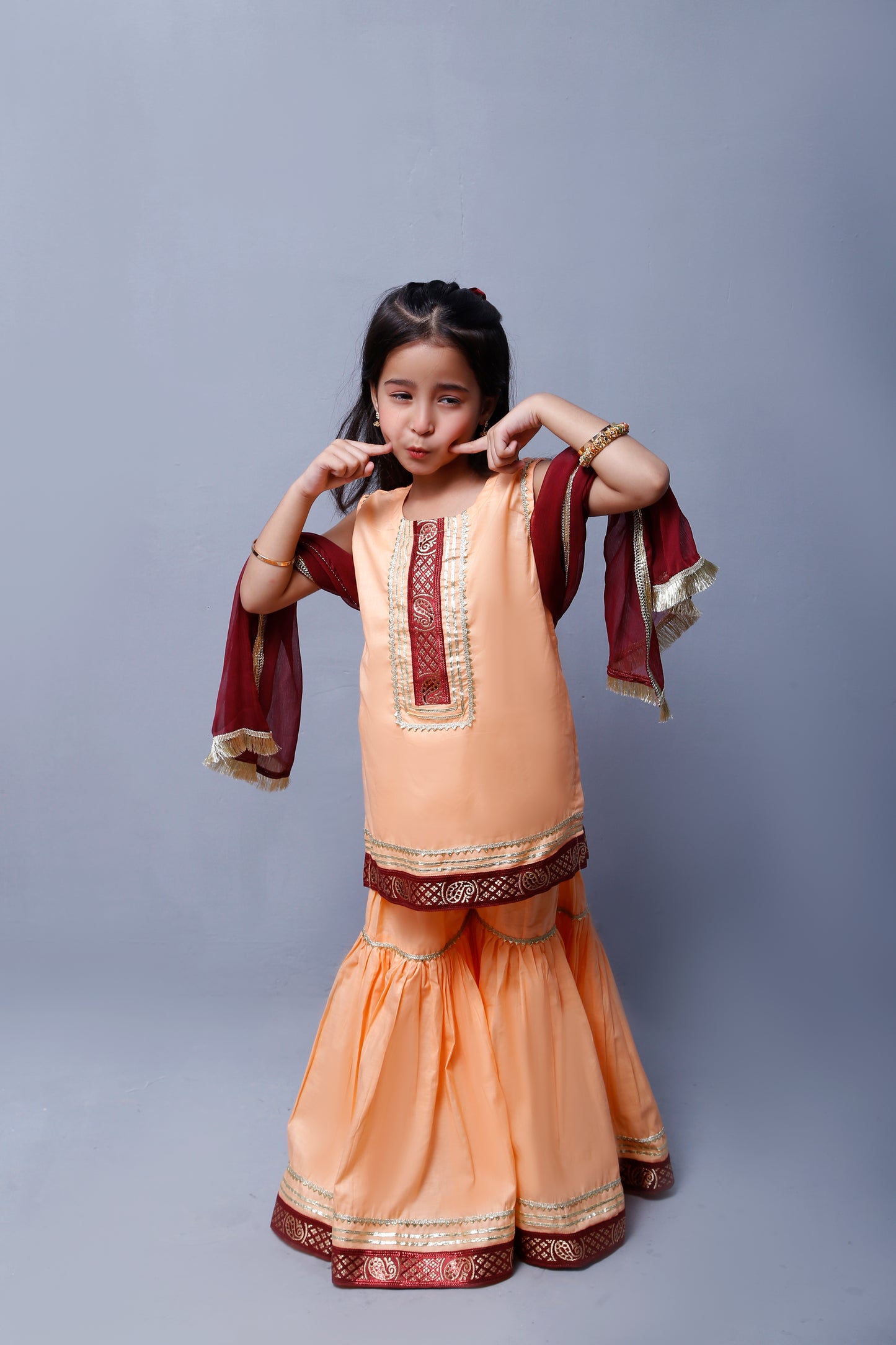3 piece Elegant Peach Cotton Sleeveless Gharara Suit with Maroon & Golden Laces with Maroon Chiffon Dupatta.(Stitch)