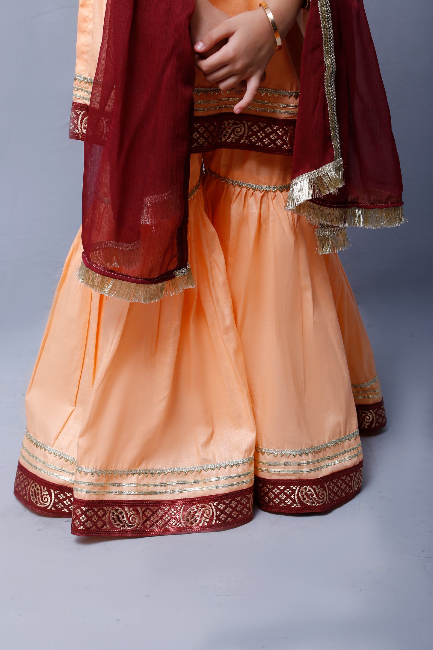 3 piece Elegant Peach Cotton Sleeveless Gharara Suit with Maroon & Golden Laces with Maroon Chiffon Dupatta.(Stitch)