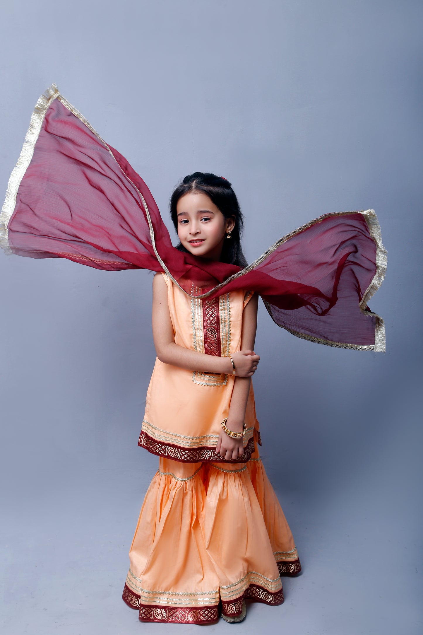 3 piece Elegant Peach Cotton Sleeveless Gharara Suit with Maroon & Golden Laces with Maroon Chiffon Dupatta.(Stitch)