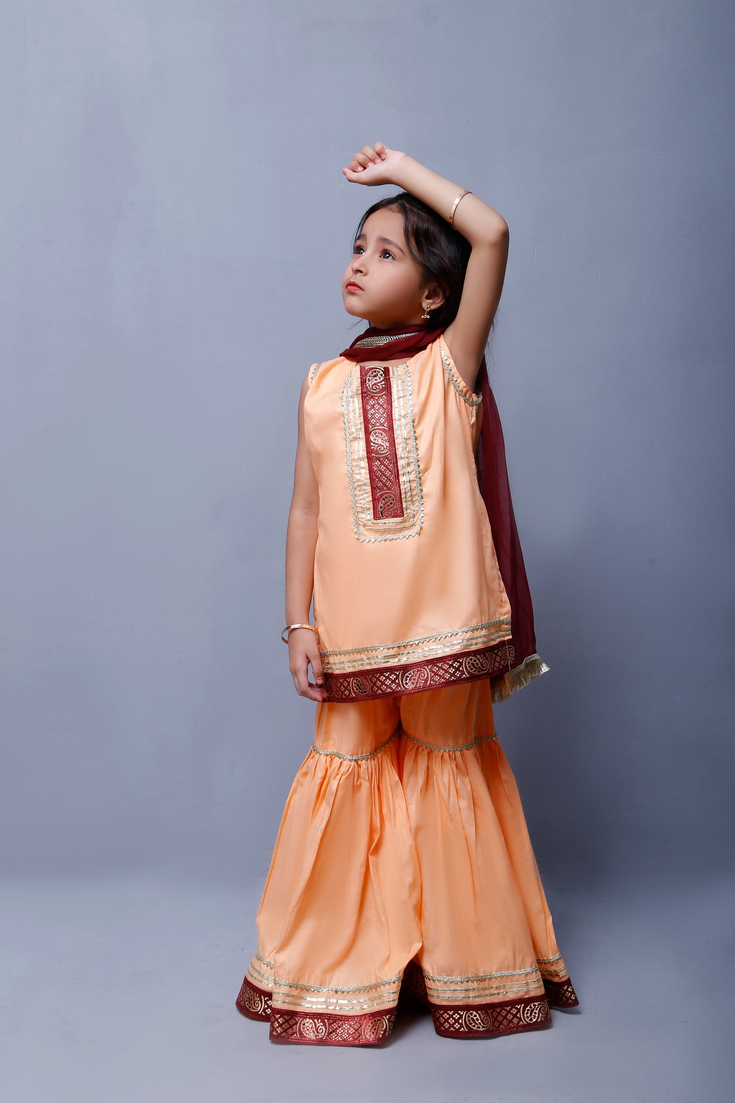 3 piece Elegant Peach Cotton Sleeveless Gharara Suit with Maroon & Golden Laces with Maroon Chiffon Dupatta.(Stitch)