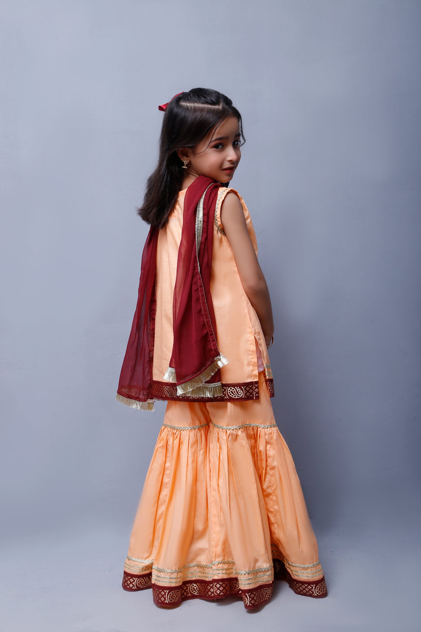 3 piece Elegant Peach Cotton Sleeveless Gharara Suit with Maroon & Golden Laces with Maroon Chiffon Dupatta.(Stitch)