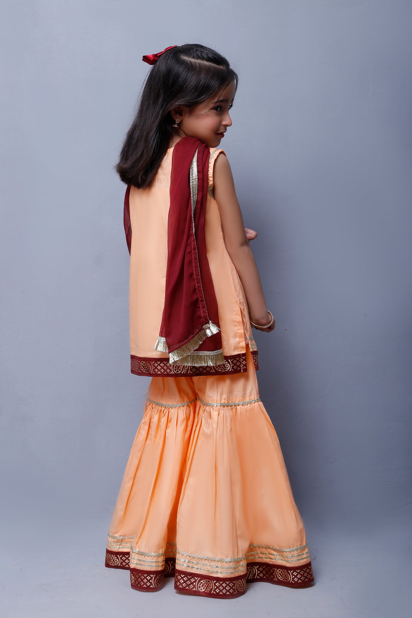 3 piece Elegant Peach Cotton Sleeveless Gharara Suit with Maroon & Golden Laces with Maroon Chiffon Dupatta.(Stitch)