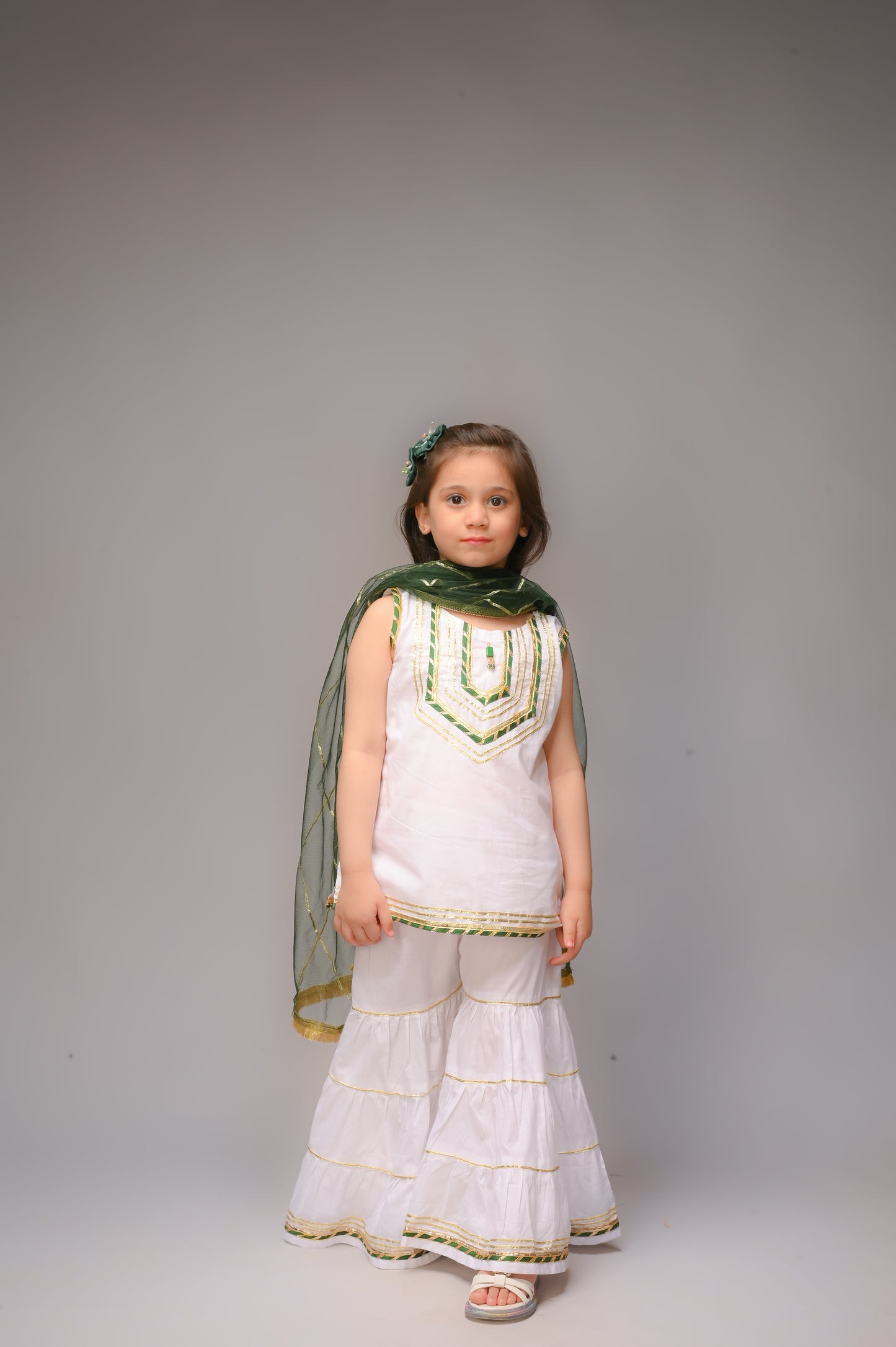 3 piece White Cotton Sleeveless Gharara Suit with Bottle Green net Dupatta & Bottle Green & Golden Laces.(Stitch).