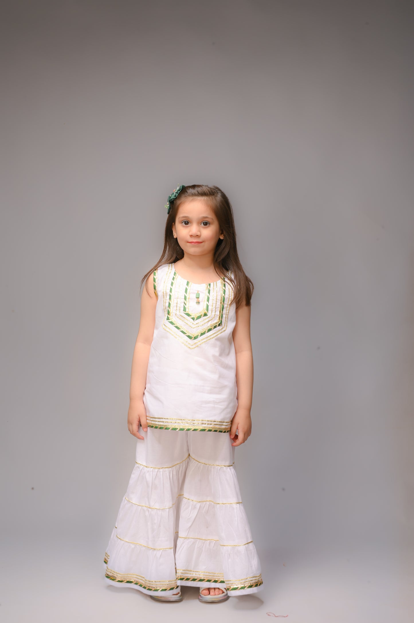3 piece White Cotton Sleeveless Gharara Suit with Bottle Green net Dupatta & Bottle Green & Golden Laces.(Stitch).