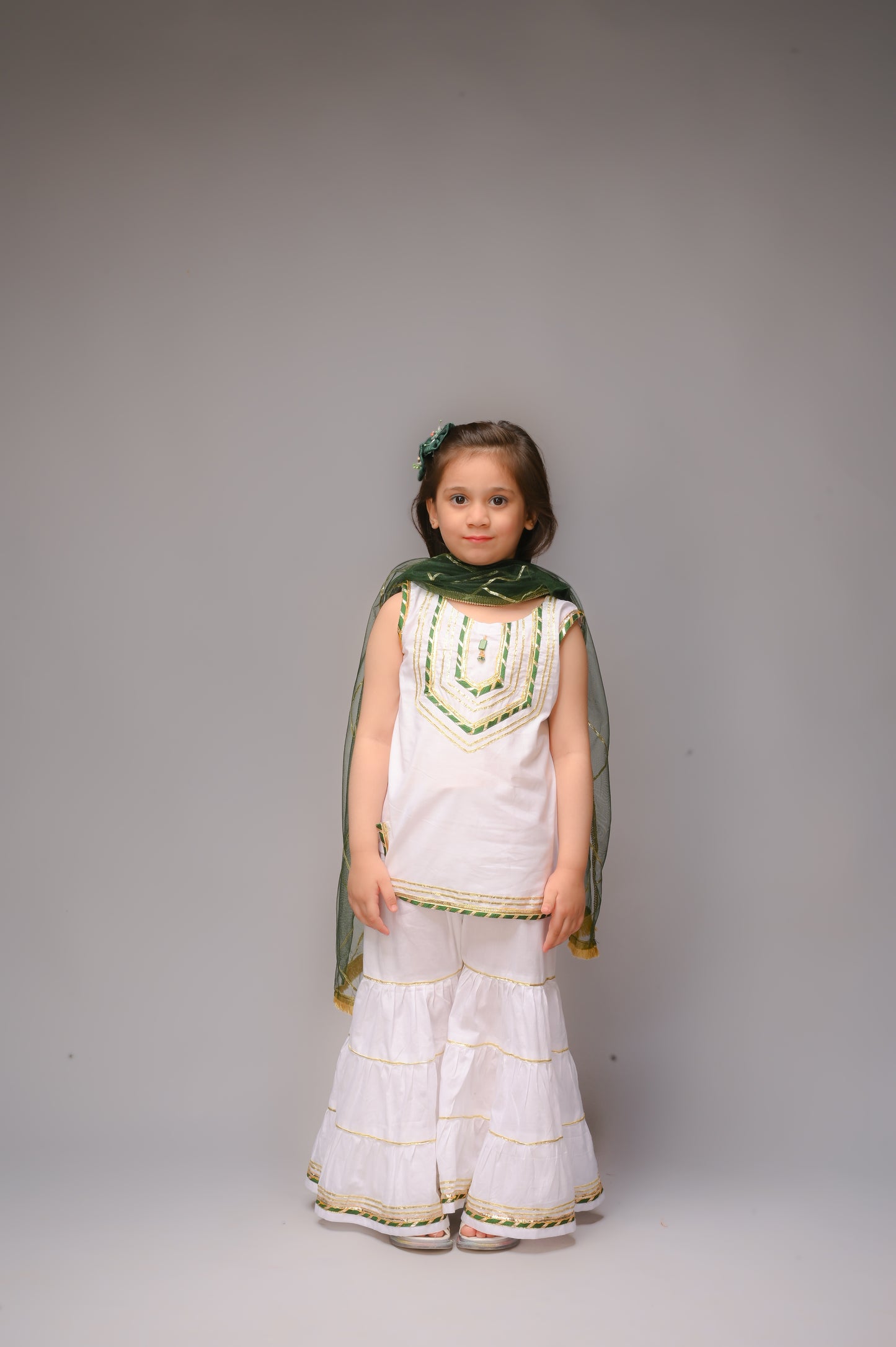 3 piece White Cotton Sleeveless Gharara Suit with Bottle Green net Dupatta & Bottle Green & Golden Laces.(Stitch).