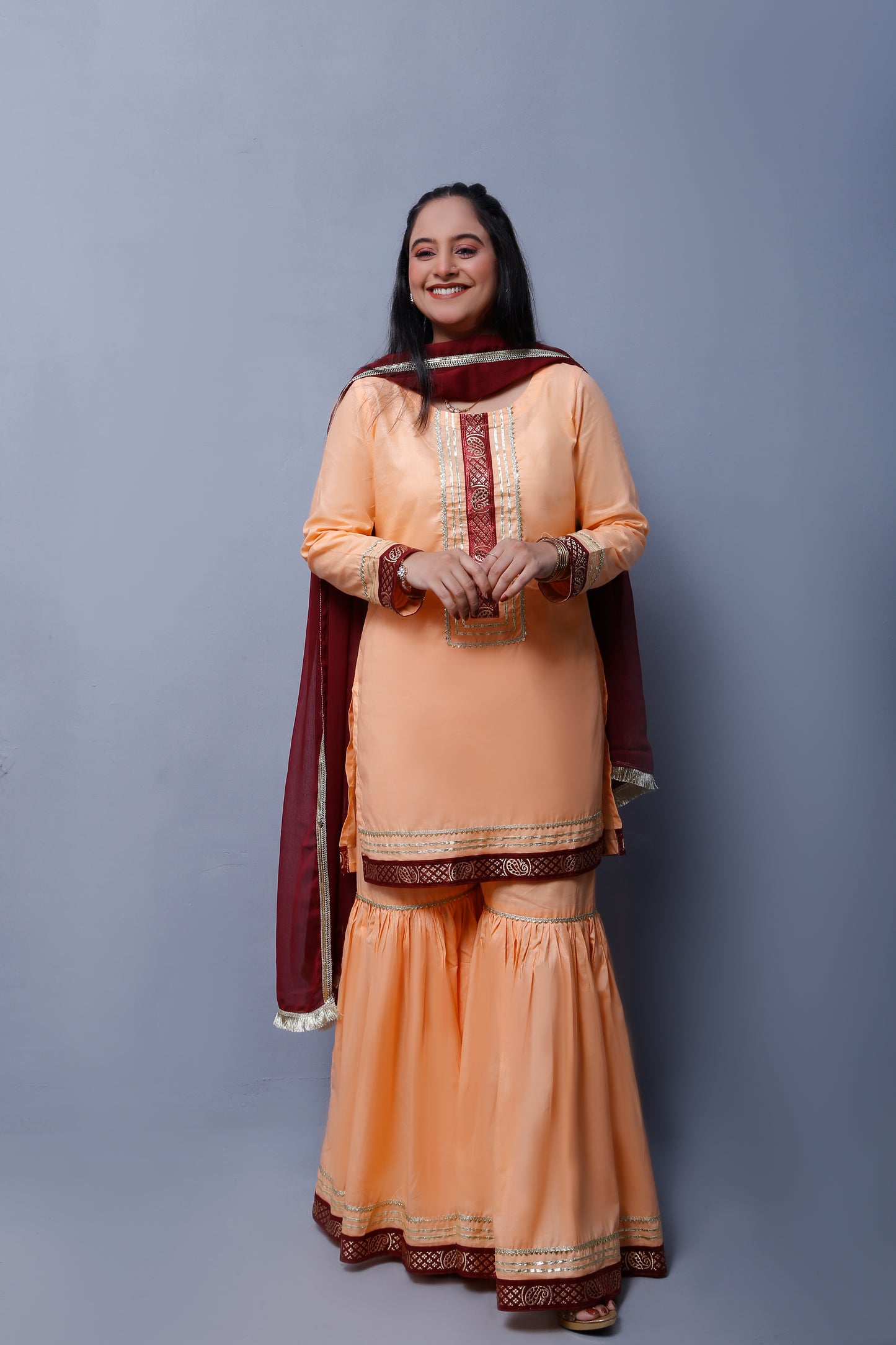 3 piece Elegant Peach Cotton Gharara Suit with Maroon & Golden Laces with Maroon Chiffon Dupatta.(Stitch)
