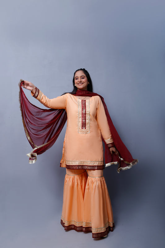 3 piece Elegant Peach Cotton Gharara Suit with Maroon & Golden Laces with Maroon Chiffon Dupatta.(Stitch)