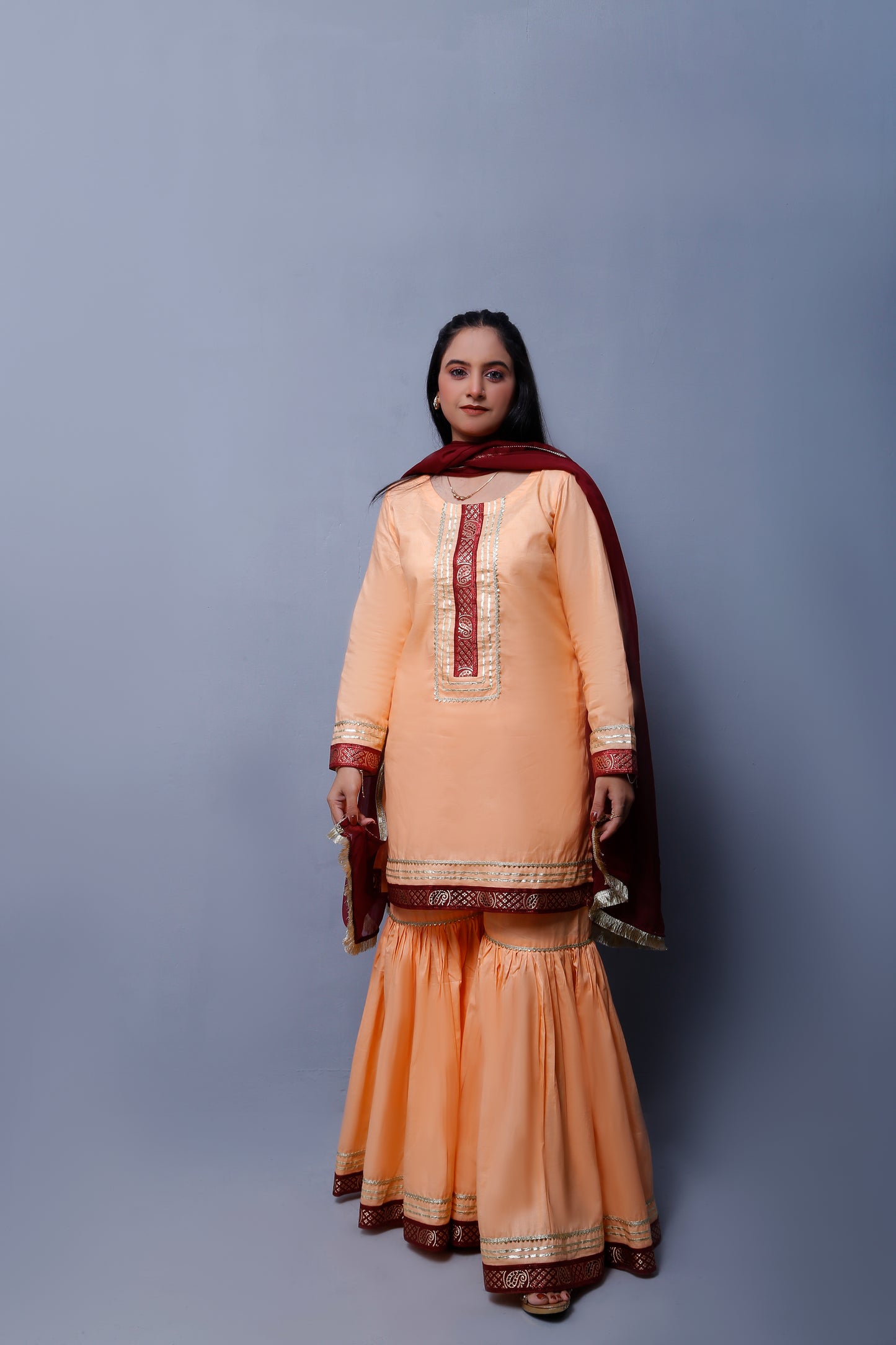 3 piece Elegant Peach Cotton Gharara Suit with Maroon & Golden Laces with Maroon Chiffon Dupatta.(Stitch)