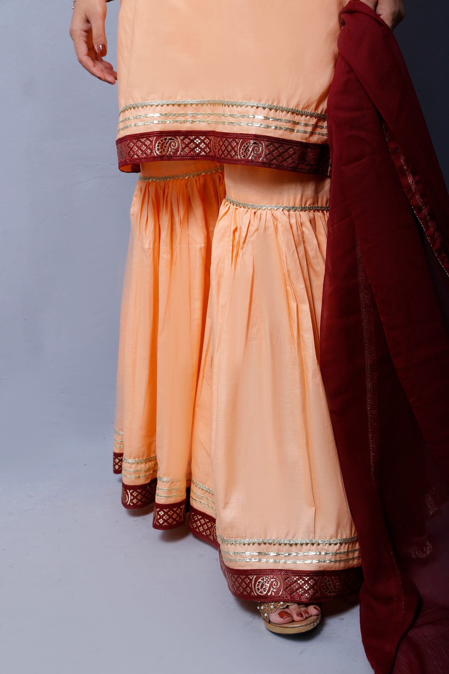 3 piece Elegant Peach Cotton Gharara Suit with Maroon & Golden Laces with Maroon Chiffon Dupatta.(Stitch)