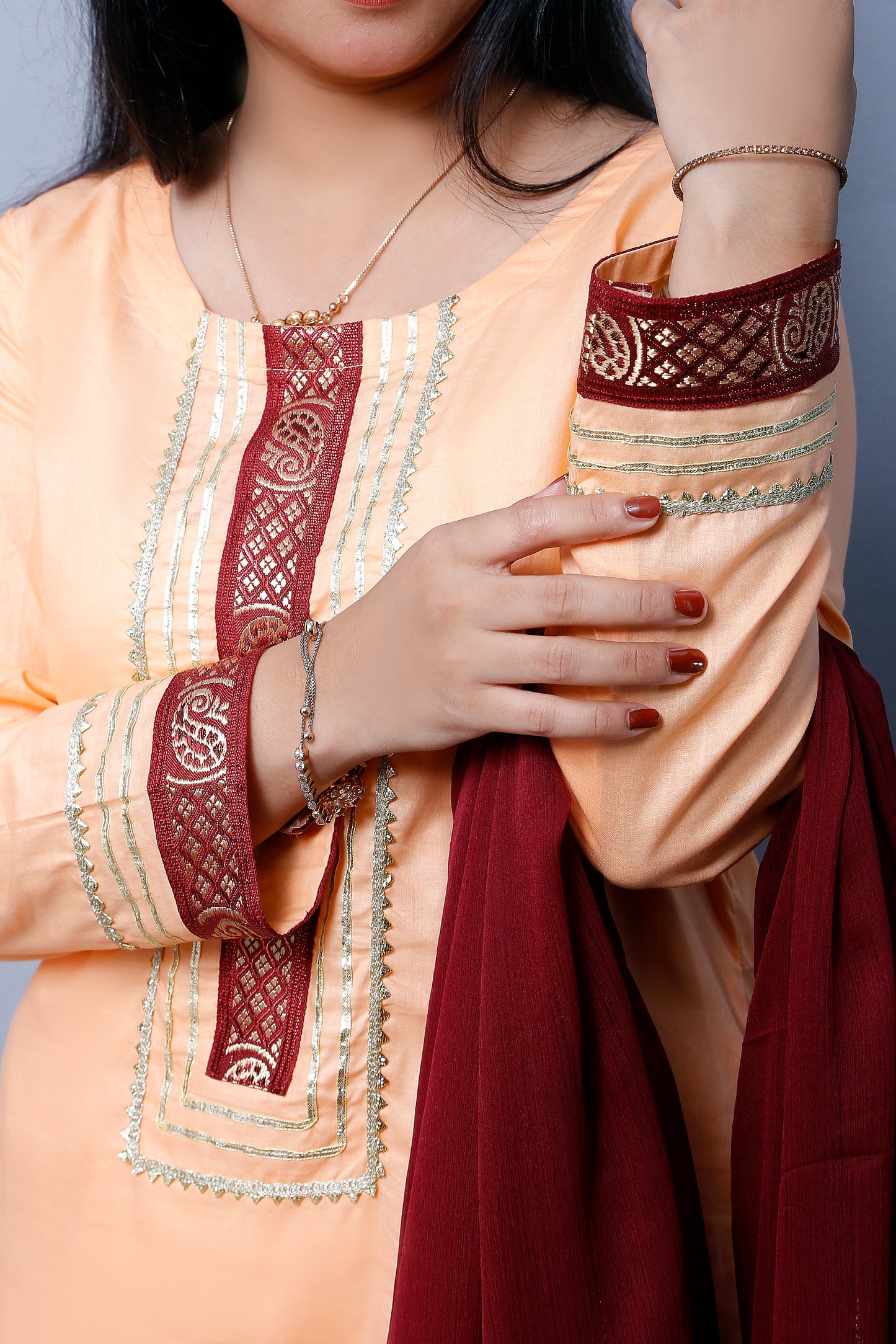 3 piece Elegant Peach Cotton Gharara Suit with Maroon & Golden Laces with Maroon Chiffon Dupatta.(Stitch)