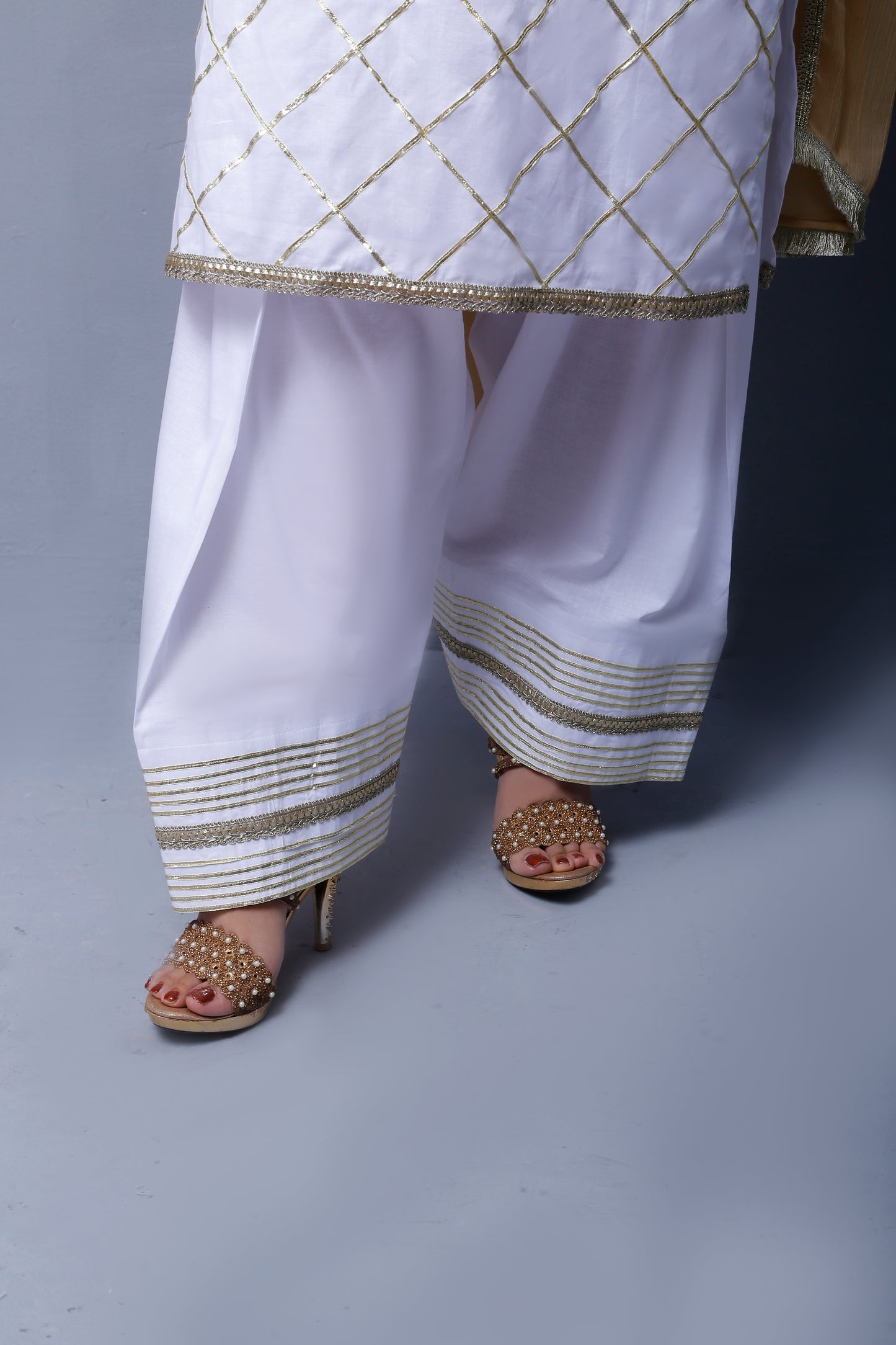 3 piece Elegant White Cotton Plazo Shalwar Kameez Suit with Golden Laces & Golden Chiffon Dupatta.(Stitch)