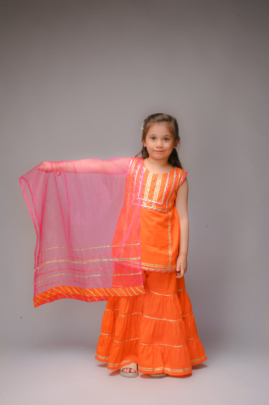 3 piece Orange Cotton Sleeveless Gharara Suit with Shocking Pink net Dupatta & Shocking Pink & Golden Laces.(Stitch).